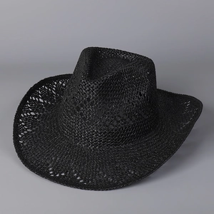 Detailed view of black woven straw cowboy hat with breathable open-work design and curved brim