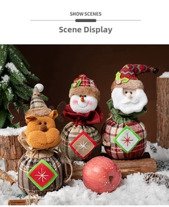 Detailed view of Christmas drawstring gift bags featuring Santa, snowman, and elk designs