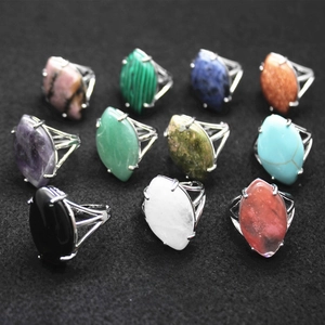 Macro view of marquise-cut gemstone rings in silver-tone four-prong settings