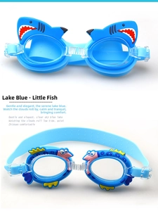 Detail view of blue shark and fish themed waterproof anti-fog swim goggles for kids