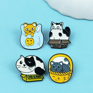Set of four cute cartoon cat enamel pins featuring orange, black, and grey kitty designs