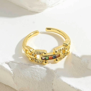 Macro shot of 14K gold plated chain ring with multi-colored zircon stones detail