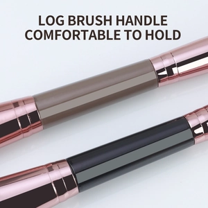 Detail of comfortable log wood brush handles with matte finish and rose gold metal ferrules