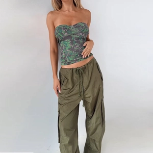 Detailed view of the camouflage print tube top paired with army green cargo pants