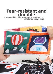 Detail showing durable tear-resistant fabric and vibrant cartoon patterns of this baby book