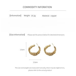 Detail showing 2.8cm textured 18K gold plated C-shape hoop earrings weighing 10.2g