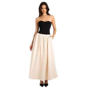 Haut bustier noir chic et jupe longue ivoire avec poches latérales pratiques pour femmes
