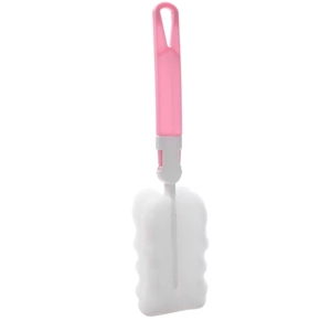 Pink long handle kitchen cup brush with a white wavy sponge head on white background