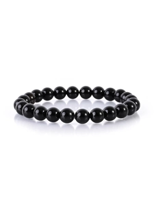 Detailed view of polished black natural stone beads bracelet with elegant reflections