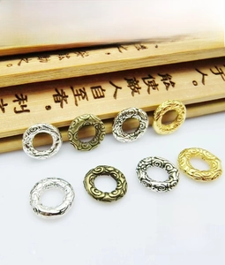 Detailed view of 8mm vintage alloy spacer beads with engraved patterns for DIY jewelry