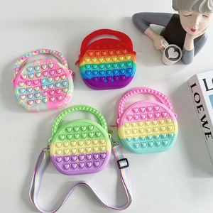 Rainbow silicone push bubble crossbody bag for women, cute heart shaped shoulder handbag.