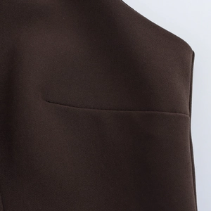 Detailed close-up of dark brown fabric texture and precise horizontal seam stitching