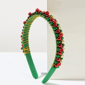 Christmas headband with red and green metallic beads and gold wire on green fabric frame