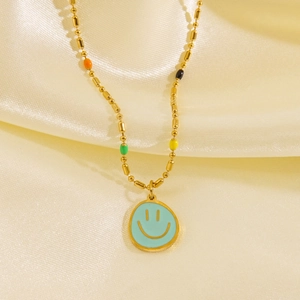 Golden titanium steel necklace with colorful turquoise enamel dog smiley face pendant
