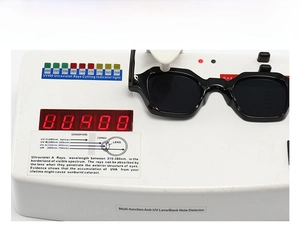 Detail showing UV400 protection test for narrow frame retro black sunglasses