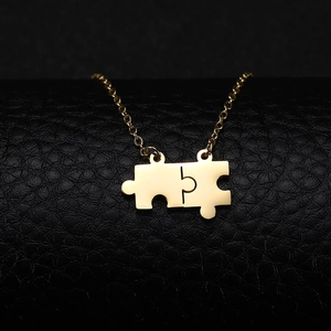 Minimalist gold stainless steel puzzle piece necklace with interlocking couple pendants