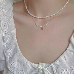 Baroque freshwater pearl double-layer necklace with a gold Fu pendant on model