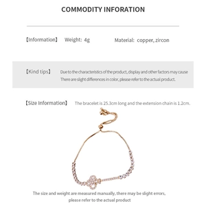 Detailed view of zircon geometric key bracelet with adjustable copper chain and clover
