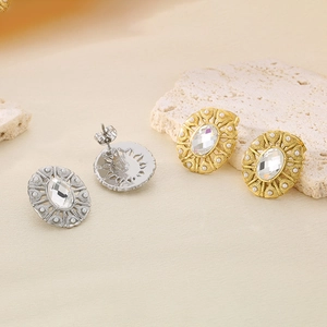 Oval textured steel stud earrings with pearls and oval gemstones in gold and silver