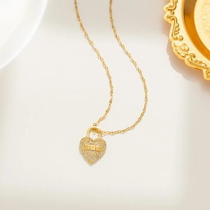 Luxurious gold heart lock necklace with 520 engraving and sparkling crystals on white base