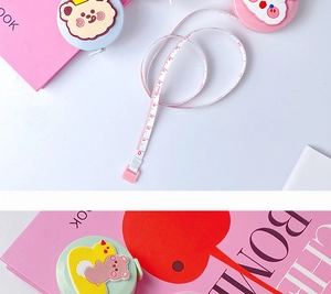 Detailed view of portable cute cartoon mini 1.5m tape measures in three pastel colors