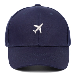 Navy blue baseball cap with white airplane embroidery and classic six-panel design