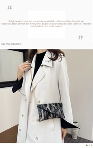 Close-up of black and white crocodile texture envelope bag with gold chain strap