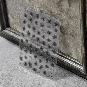 Self-adhesive translucent 5D nail stickers featuring elegant black floral line art designs