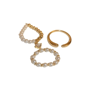 Three-piece gold plated ring set with pearls and zircons in a minimalist geometric design