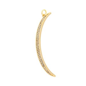 Detailed macro view of a gold crescent moon pendant with micro-pave cubic zirconia crystals