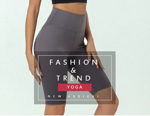 Detail of high-waisted dark grey yoga shorts showing supportive fabric and body-contouring fit
