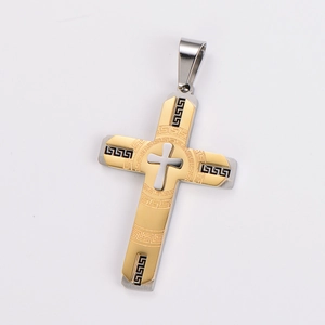 Detailed macro view of two-tone stainless steel cross pendant with Greek key pattern