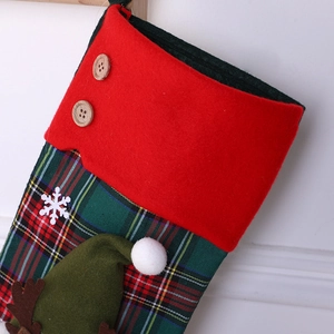 Knitted Christmas stocking with red-green plaid pattern and festive 3D elf decorations