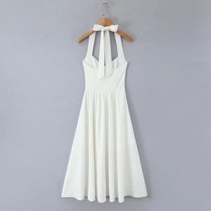 Elegant white halter neck sleeveless maxi dress with slit and back ribbon detailing