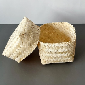 Macro shot of natural bamboo woven storage box showing detailed texture and lid design