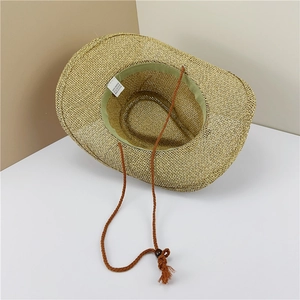 Detailed macro of straw cowboy hat interior showing sweatband and adjustable drawstring