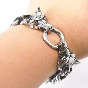 Polished stainless steel double wolf head leather bracelet worn on wrist for men