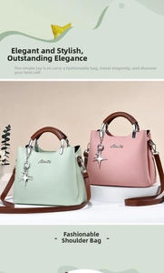 Detail of mint green and dusty pink PU leather handbags with star pendant charms