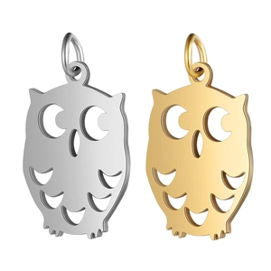 Detail of owl shaped stainless steel pendants in silver and gold for DIY jewelry