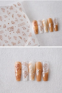 Macro detail of MN-190 nail stickers featuring caramel rose and butterfly designs
