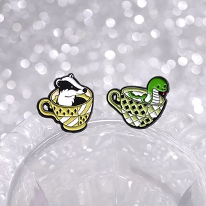 Cartoon enamel pins with badger and snake designs in colored teacups decorative jewelry