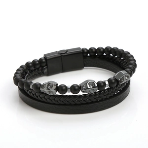 Handmade multi-layer black leather bracelet with steel skulls and magnetic clasp