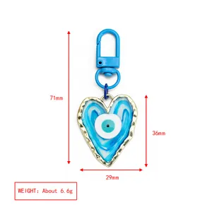 Detailed size chart showing the 71mm length of the heart-shaped evil eye keychain