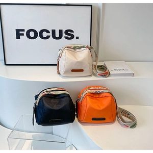 Three-color shell-shaped oxford fabric bags with decorative geometric wide shoulder straps