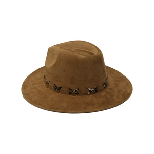Detail of dark brown suede jazz hat with black decorative band and cross stitch design