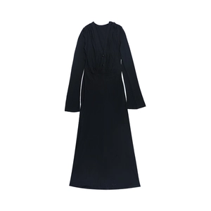 Detailed close-up of a black long-sleeve V-neck dress with button-down front accents