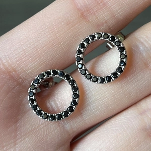 Chic silver hollow circular stud earrings with shimmering black zircon pave stones