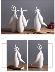 Three-piece set of white ceramic abstract dancer figurines with a matte finish decor