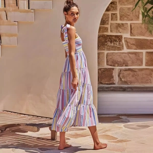 Colorful striped tiered summer maxi dress with bow straps and a smocked bodice