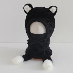 Close-up of soft plush kids hood with bear ears and integrated neck warmer in black and white